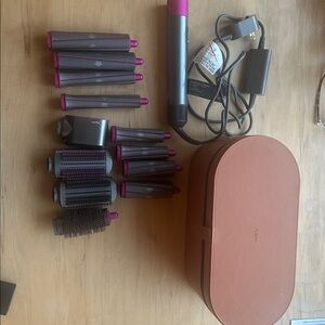 Dyson Aiwrap complete with leather case and additional attachments